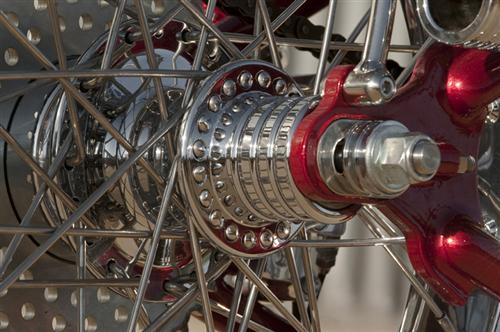 Custom hub with the left side spokes set to be 1-inch shorter than the right.
