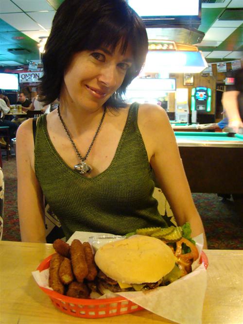 This is Josh's girlfriend, Celia. He allows her to sit of front of 2000 greasy calories, but she isn't allowed to eat it.