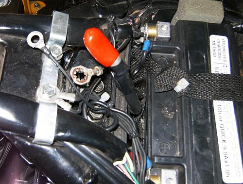 Remove seat and disconnect negative side of the battery. 