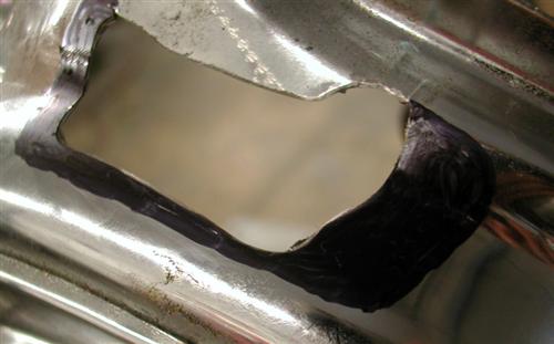 We made two runs at cutting enough tin to create the needed clearance.