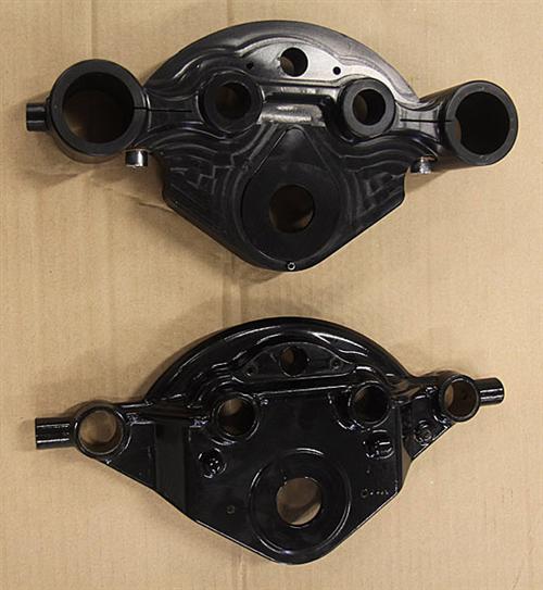 The CCE machined billet aluminium triple tree is shown at the top with the cast Harley-Davidson one at the bottom. There is a considerable weight saving with the aluminium unit.
