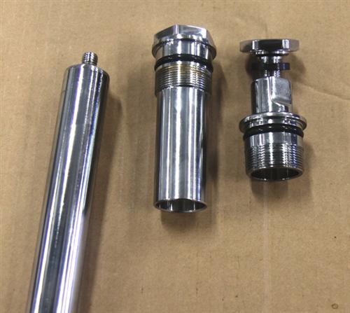 The top section of the CCE fork tube is shown on the left with the CCE fastening nut beside it. The stock Harley-Davidson set up is shown on the right.