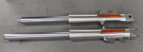 The top lower fork leg still contains the old fork tube while the one on the bottom has had the CCE tube installed.