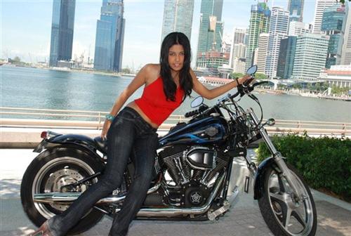 Marilyn with Fredrik Lönnquist's 2004 Night Train Custom near the Singapore Marina.
