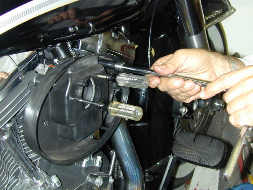 using screwdriver to hold AC gasket in place