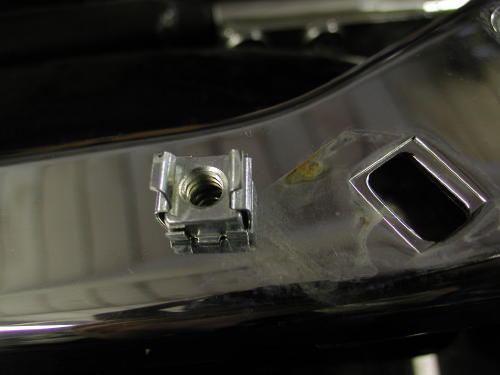bag bracket fastener removed from rail 15