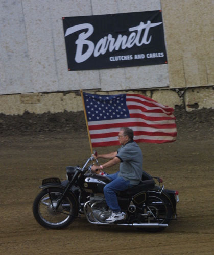 guy on ariel on track w flag