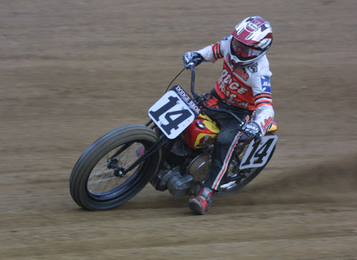 red and yellow indian kicking dirt