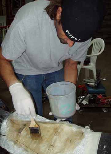6 brushing resin on fiberglass