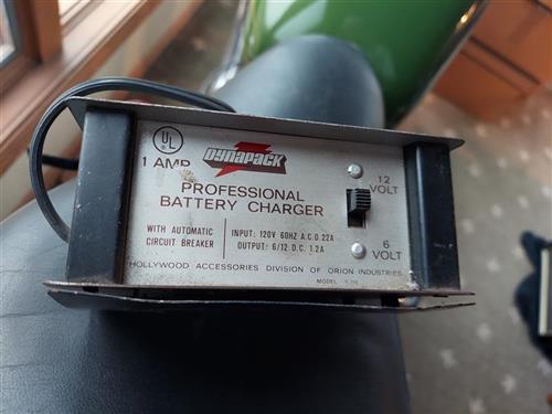 This is an old charger. It works on 6 or 12 Volt batteries, but you need to keep an eye on it and unplug the bastard before you go to bed.